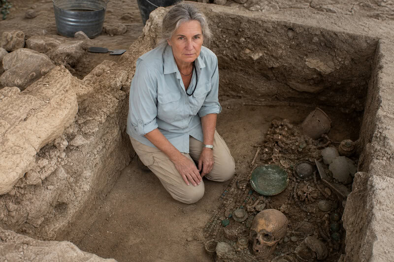 An archaeologist excavates a burial chamber at Caracol