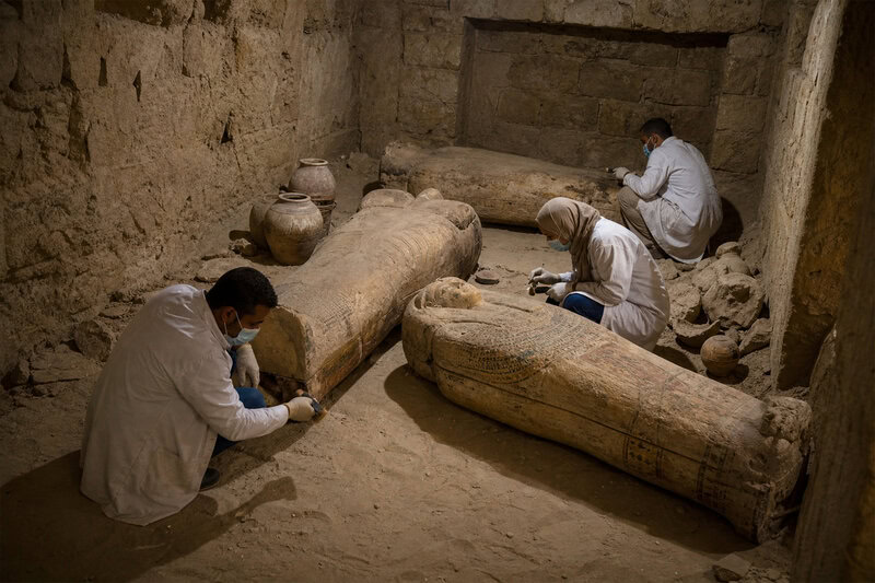 A scene from the excavation of a 4,000-year-old Saqqara tomb whose sealed chambers yielded sarcophagi, pottery