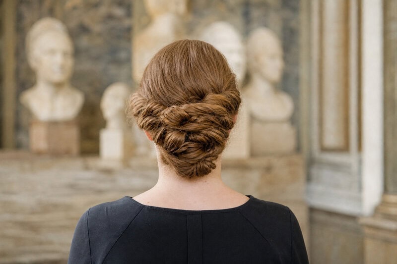 The recreated seni crines hairstyle, braided and stitched with needle and thread, proved the ancient Roman style required&hellip;