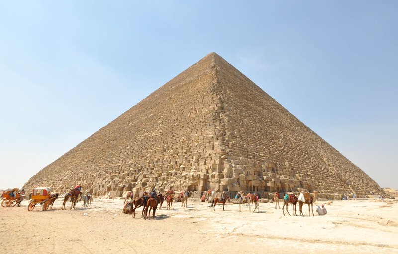 Image 0 shows the Great Pyramid of Khufu/Cheops clearly and fully, high resolution, with camels and horses providing scale.
