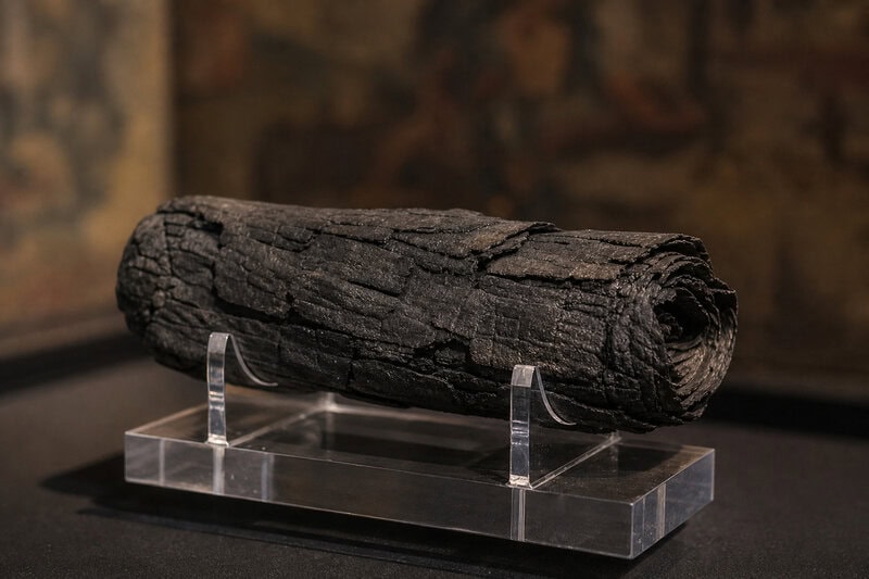 A carbonized Herculaneum scroll of the kind recovered from Vesuvius