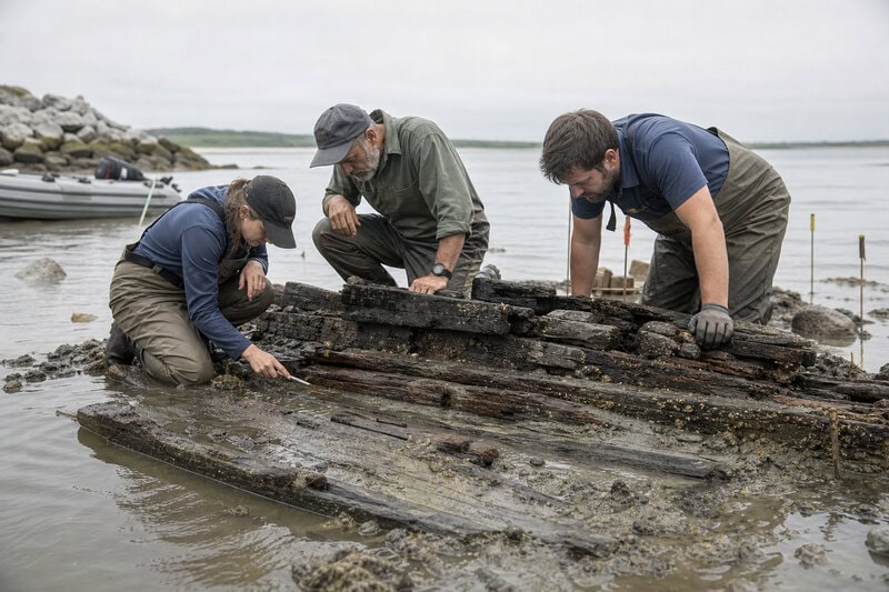 Archaeologists examine the exposed timbers of a Nantucket shipwreck whose joinery and construction details match no vessel&hellip;
